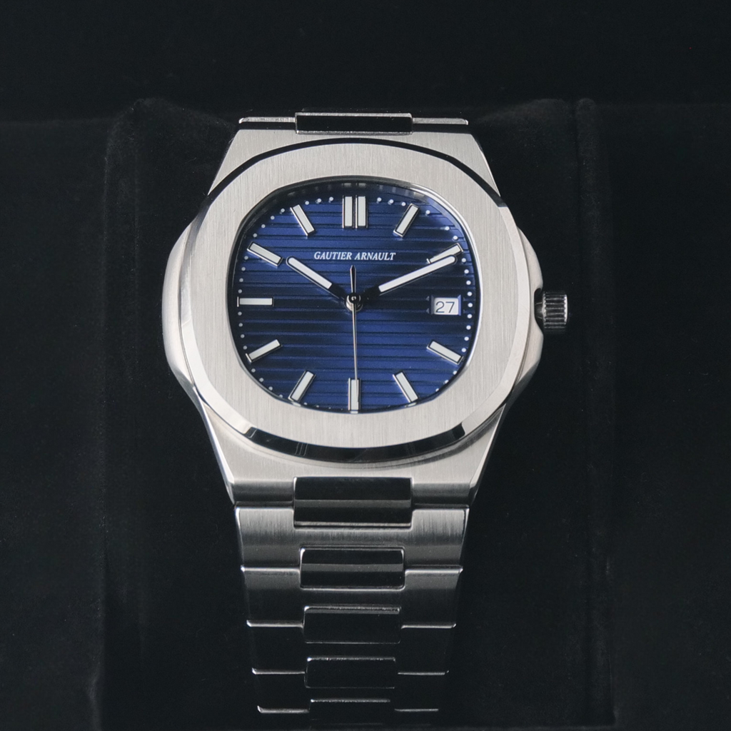 Silver watch with blue dial on a black background